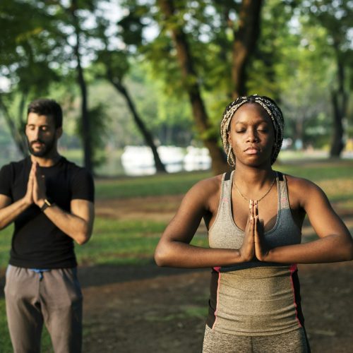 People yoga in a park