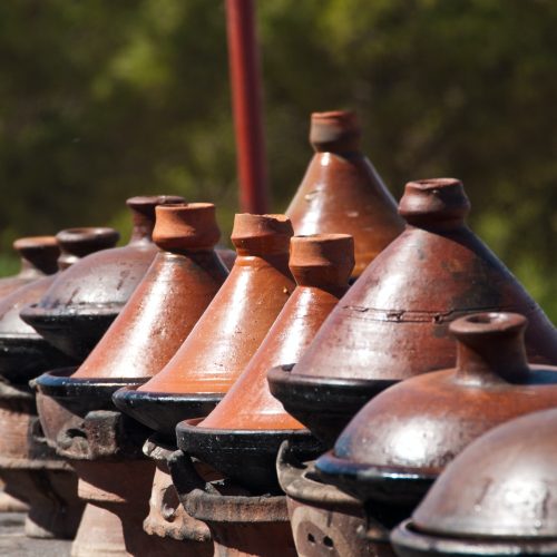 Row of Moroccan clay tagines - traditional cooking vessels